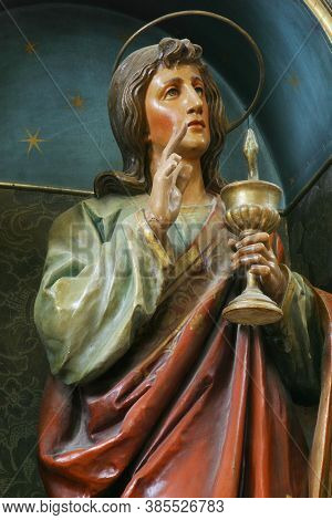 SVETI IVAN ZELINA, CROATIA - JUNE 26, 2013: Saint John the Evangelist statue on the altar at Our Lady of Sorrows parish church of Saint John the Baptist in Sveti Ivan Zelina, Croatia