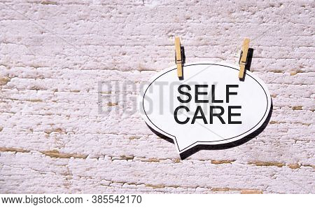 Self Care On A White Sheet With Wooden Pins