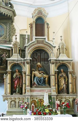 SVETI IVAN ZELINA, CROATIA - JUNE 26, 2013: Altar of Our Lady of Sorrows in the parish church of Saint John the Baptist in Sveti Ivan Zelina, Croatia