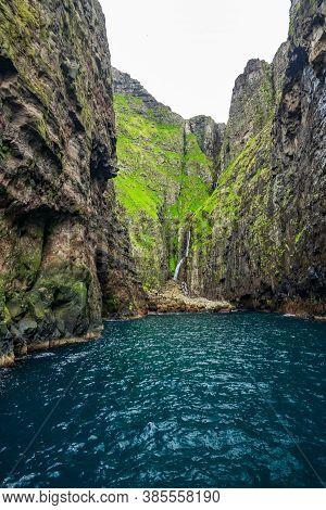 Spectacular Vestmanna Cliffs And Waterfall In Faroe Islands
