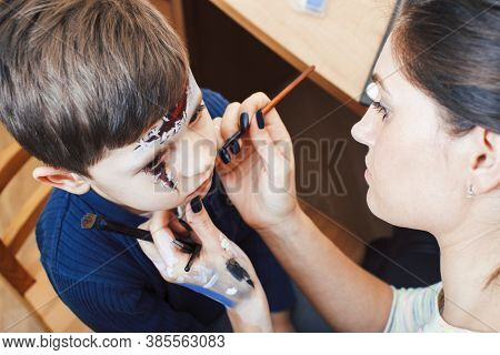 Little Cute Child Making Facepaint On Birthday Party, Zombie Apocalypse Facepainting, Halloween Prep
