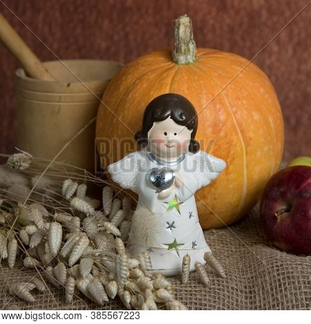 Little Angel, Pumpkin And Apples.  Thanksgiving Day Holiday Concept