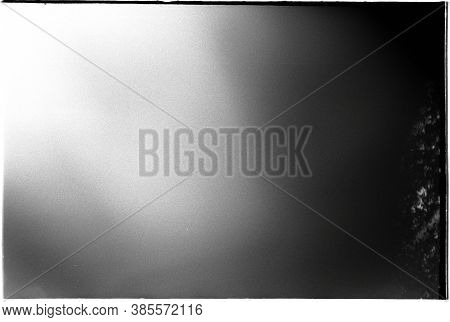 A Real Film, Black And White 35 Mm Format Spoiled Photo With Dust And Scratches. Photographic Film W