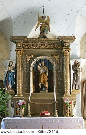 RADOBOJ, CROATIA - SEPTEMBER 21, 2014: The altar of Saint Joseph in the parish church of the Holy Trinity in Radoboj, Croatia