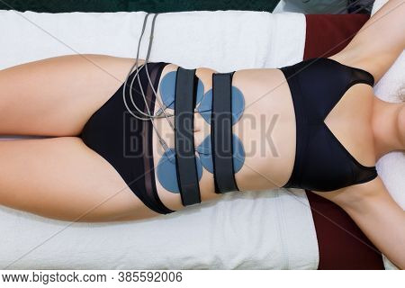 Myostimulation Electrodes Are Installed On The Abdomen. Anticellulite Massage Myostimulation For A B