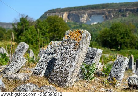 Vadul Rascov, Soldanesti, Moldova, September 2020: Old ruined tombstones at the ancient Jewish cemetery, now abandoned. Jewish communuty was massacred by nazis during WW2.