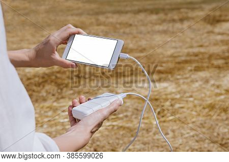 Mock Up Of A Smartphone And The Power Bank, In The Hand Of A Girl.