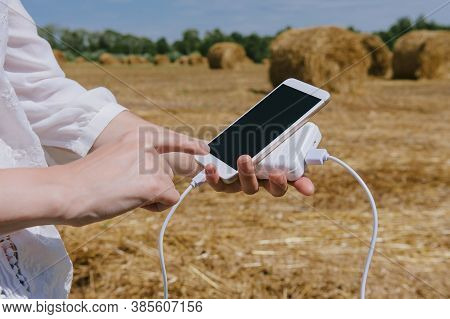 Mock Up Of A Smartphone And The Power Bank, In The Hand Of A Girl.
