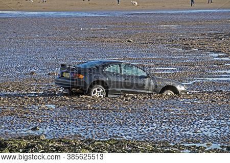 Weston-super-mare - February 2, 2014: A Car Which Had Been Trapped By The Incoming Tide Partially Bu