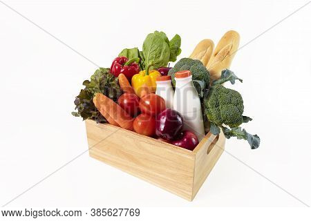 Wooden Crate With Multi Color Vegetables , Fruit, Milk And Baguette Isolated On White Bakcground. Gr
