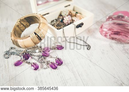 Jewelry On Box On The Wooden Desk