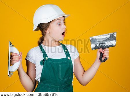 Oh My God. Happy Small Construction Girl With Spatula. Teen Girl Use Putty Knife. Builder In Coveral