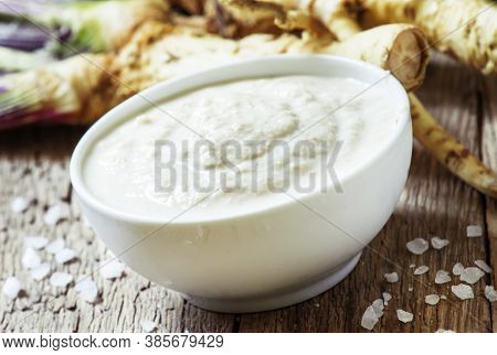 Ground Horseradish, Hot Sauce To The Food In A White Bowl, Roots And Leaves Of Fresh Horseradish, Vi