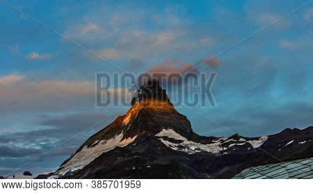 Zermatt, Switzerland. Matterhorn Mountain Near Grindjisee Lake With Flowers In The Foreground. Canto