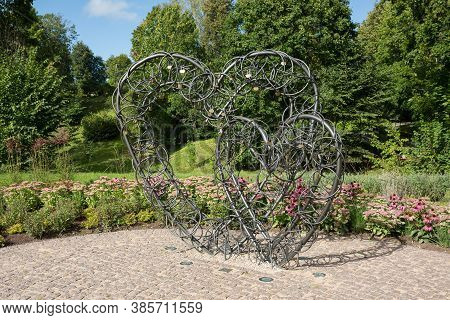 City Smiltene, Latvia.iron Hearts And A Green Park Around.