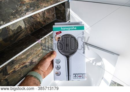 Paris, France - Sep 4, 2020: Male Hand Showing In Luxury Bathroom With Natural Stone The Package Of 