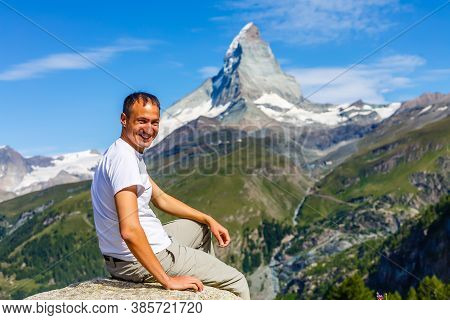 Active Family Hiking In High Alpine Region In Alps