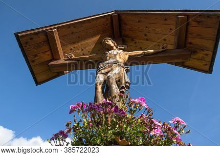 Mustair, Switzerland - September 8, 2020: Roadside Sign Of The Cross In Mustair