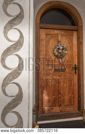 Mustair, Switzerland - September 8, 2020: Wooden Door Of An Old House In Mustair