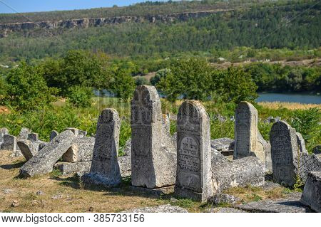 Vadul Rascov, Soldanesti, Moldova, September 2020: Old ruined tombstones at the ancient Jewish cemetery, now abandoned. Jewish communuty was massacred by nazis during WW2.