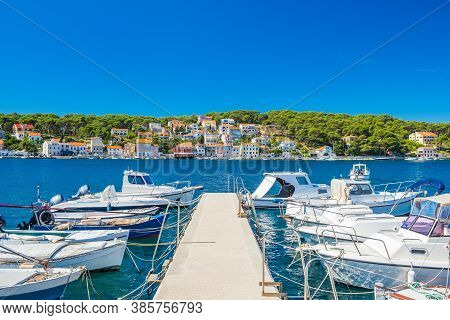 Town Of Mali Losinj On The Island Of Losinj, Adriatic Coast In Croatia, Boats On Docks And Old House