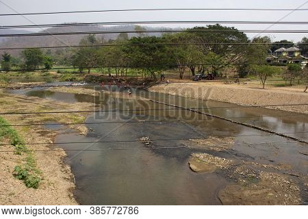Thai Children Student Educational Tour Resting Relax And Swimming And Playing Water In Pai River At 