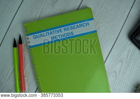 Qualitative Research Methods Write On A Book Isolated On Office Desk.