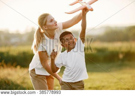 Multi-racial Family Playing In A Summer Park