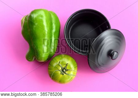 Black Pot, Green Pepper And Green Tomato