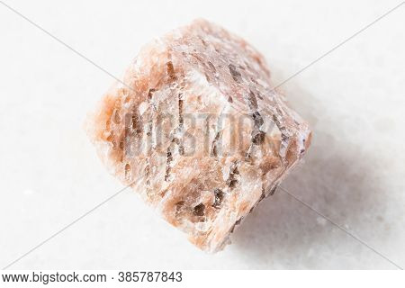 Closeup Of Sample Of Natural Mineral From Geological Collection - Rough Granite Pegmatite Rock On Wh
