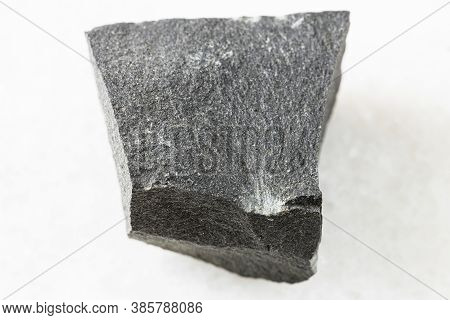 Closeup Of Sample Of Natural Mineral From Geological Collection - Unpolished Hyalobasalt Rock On Whi
