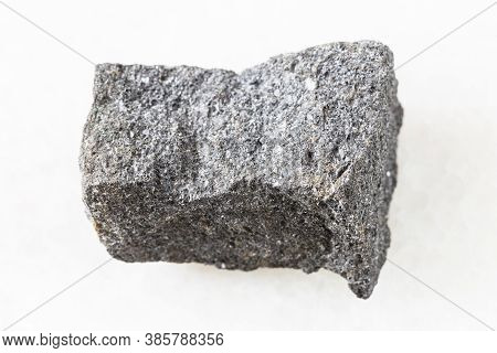 Closeup Of Sample Of Natural Mineral From Geological Collection - Unpolished Chromite Rock On White 
