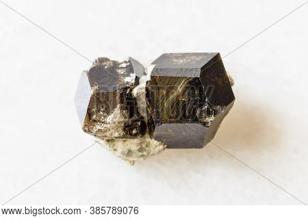 Closeup Of Sample Of Natural Mineral From Geological Collection - Rough Andradite Garnet Rock On Whi