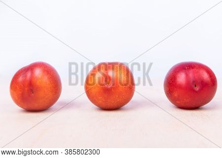 Red Plum Fruit On The White Background Isolated