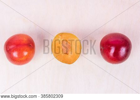Red And Yellow Plum Fruit On The White Background Isolated Top View