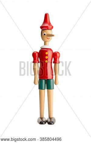 Pinocchio Puppet Isolated On White Background. Wooden Figurine