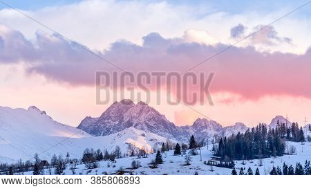 Sunset With Dramatic Sky And Snowy Mountain Peaks Illuminated By Sunlight, Tatra Mountains In Winter