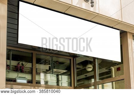 Horizontal Black Empty Signage On Clothes Shop Front With Glass Windows