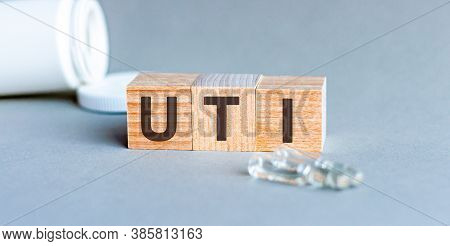 Uti - Acronym From Wooden Blocks With Letters, Abbreviation Uti Urinary Tract Infection, Concept, Gr