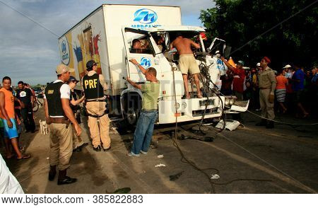 Eunapolis, Bahia / Brazil - January 28, 2009: People Come To The Rescue Of A Truck Driver Trapped In