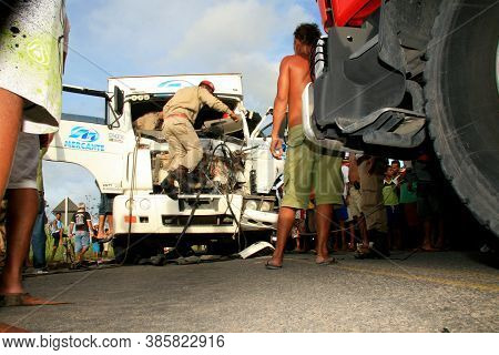 Eunapolis, Bahia / Brazil - January 28, 2009: People Come To The Rescue Of A Truck Driver Trapped In