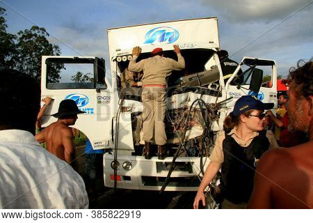 Eunapolis, Bahia / Brazil - January 28, 2009: People Come To The Rescue Of A Truck Driver Trapped In