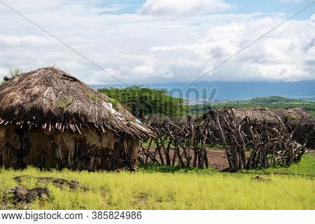 Traditional Maasai Village With Clay Round Huts In Engare Sero Area Near Lake Natron And Ol Doinyo L