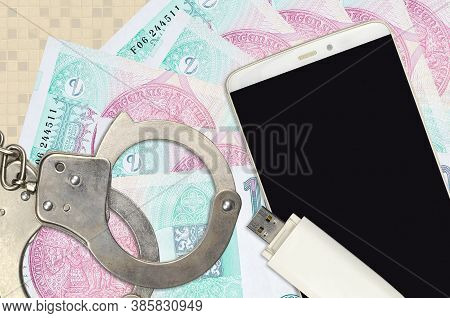 100 Czech Korun Bills And Smartphone With Police Handcuffs. Concept Of Hackers Phishing Attacks, Ill