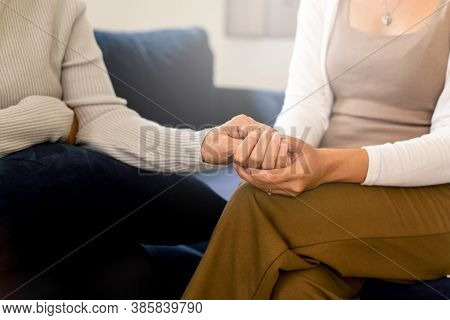 Caregiver Woman Holding Hands To Elderly With Alzheimer Disease At Home,adult Social Care Concept