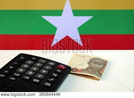 One Of Banknote Currency Myanmar Kyats With Calculator On The White Floor With The Union Of Myanmar 