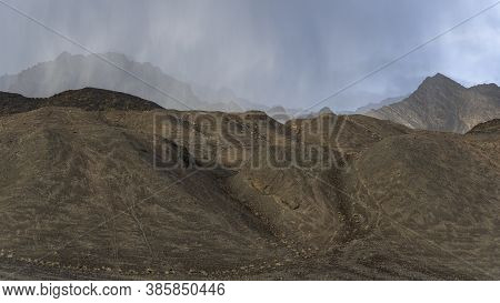 Bare Mountains In The Valley Of The River Murghab With Dark Rain Clouds Near The Village Of Murghab,