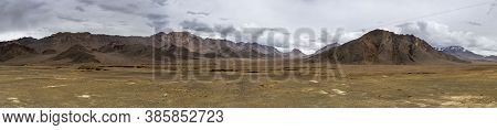 Panorama Of Rain, Clouds And Orange Colored Mountains With Snow At The Pamir Highway In Tajikistan N
