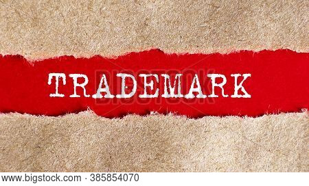 Trademark Appearing Behind Torn Paper .business Concept