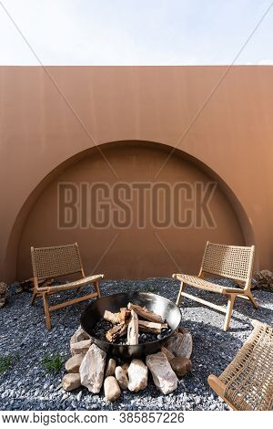 Minimal Empty Space Scene With Brown Painted Wall And  Rattan Armchair And Artificial Cactus With Ro